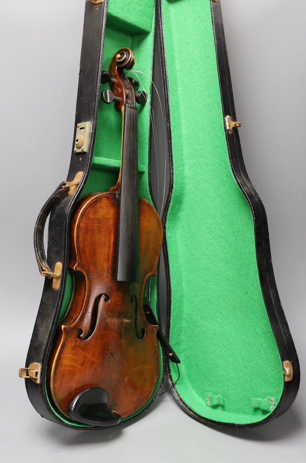 A violin labelled 'Albani Palermo', cased, length of back 35.5cm